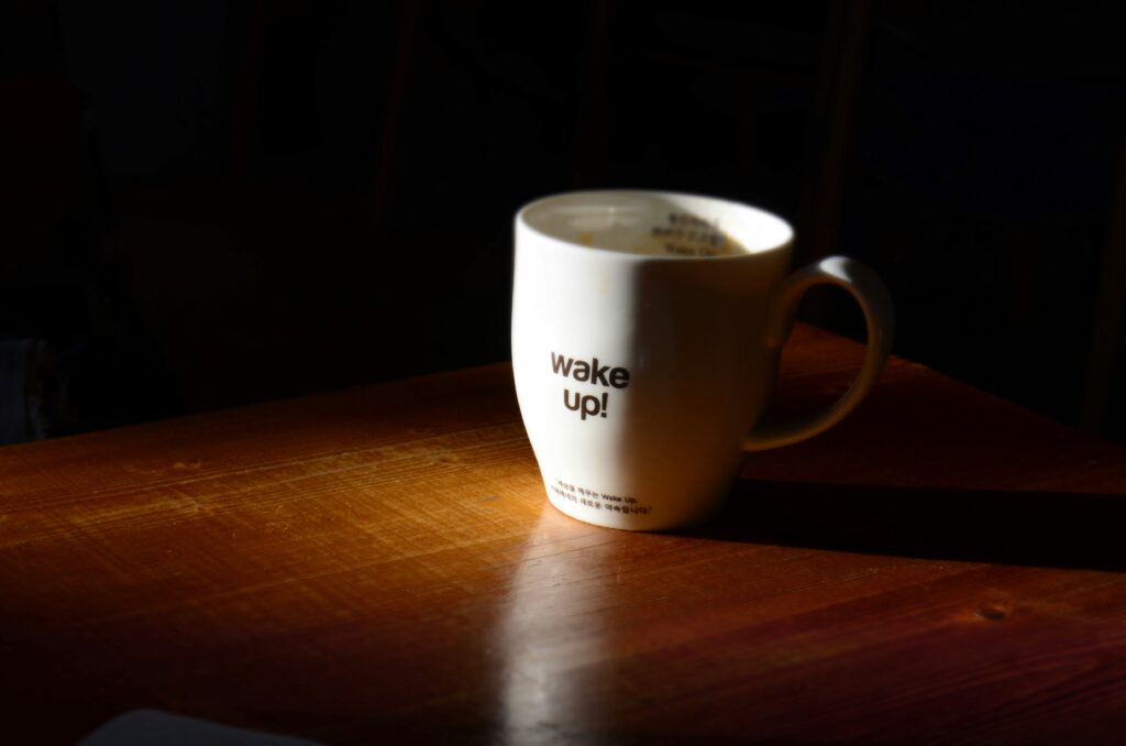 a mug saying 'wake up' to illustrate moving beyond resilience